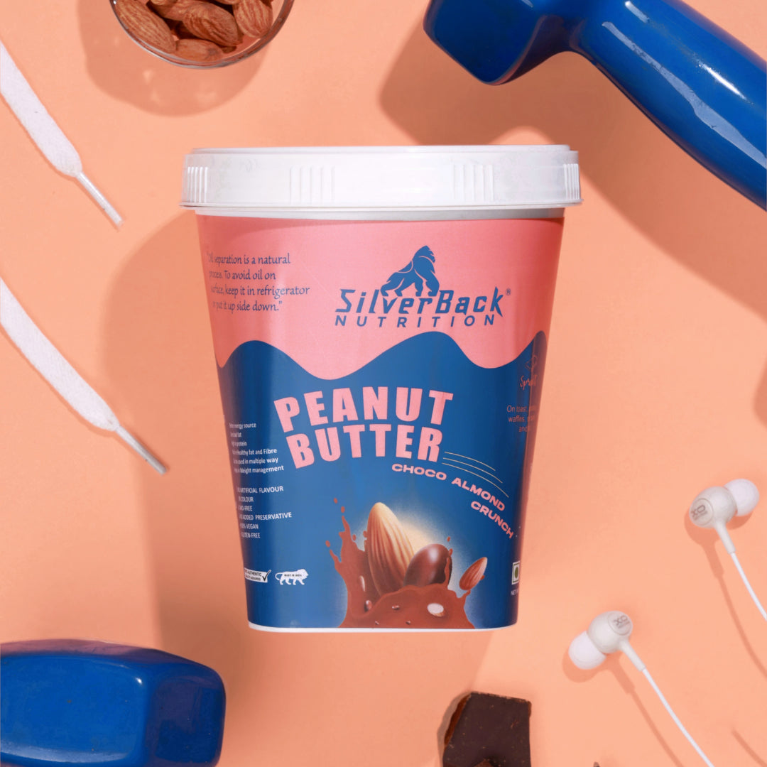 SilverBack Nutrition chocolate peanut butter jar with almonds in bowl, chocolate peanut cream slice, ear phone