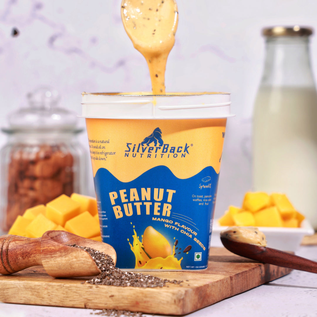 SilverBack Nutrition mango peanut butter, taking peanut butter from jar, chia seed spread, mango slices, milk bottle