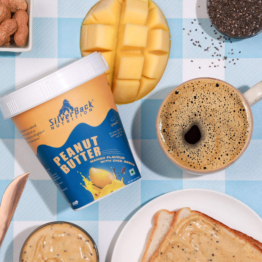 SilverBack Nutrition mango peanut butter with chia seed, peanuts, peanut butter spread on bread, full coffee cup